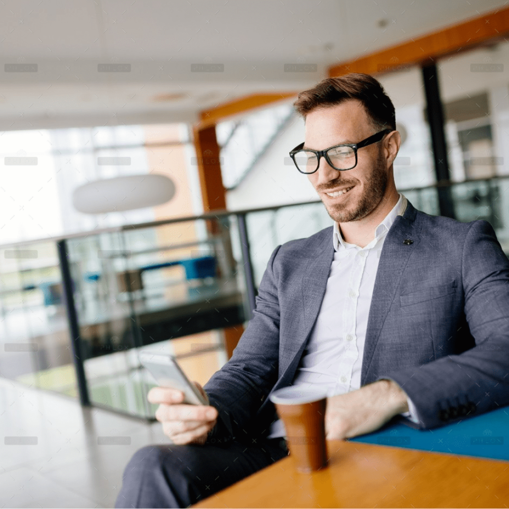 demo-attachment-713-businessman-taking-a-break-with-a-cup-of-coffee-JW4B3DH